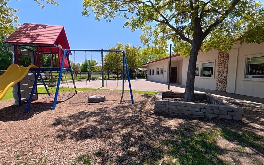 Shaded playground and play yard at Kids Inc. Preschool in Folsom, CA