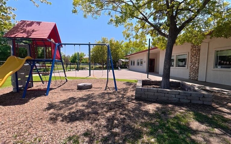Shaded playground and play yard at Kids Inc. Preschool in Folsom, CA