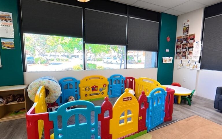 Safe infant play area with soft toys at Kids Inc. Preschool
