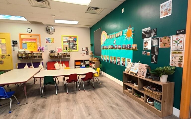 Pre-K classroom with art displays and work tables